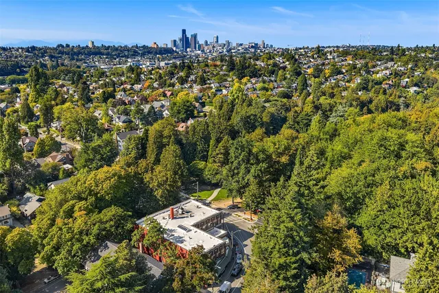 an aerial view of a house with a yard