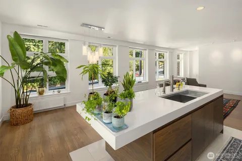a dining room with furniture and wooden floor