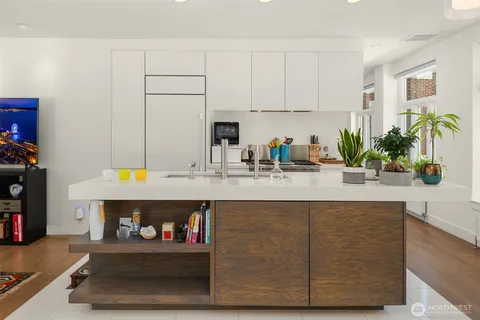 a kitchen with a sink and a stove top oven