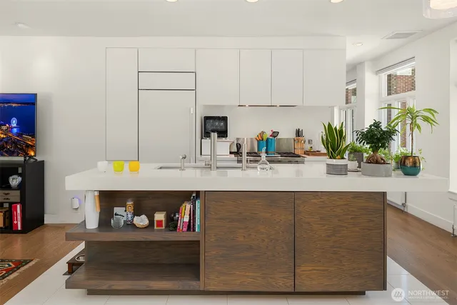a kitchen with a sink and a stove top oven