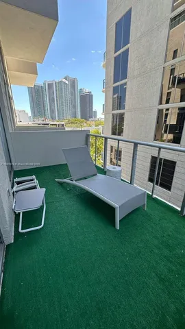 a view of a chairs in backyard of the house