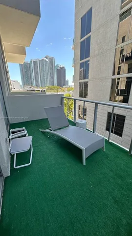 a view of a backyard with table and chairs