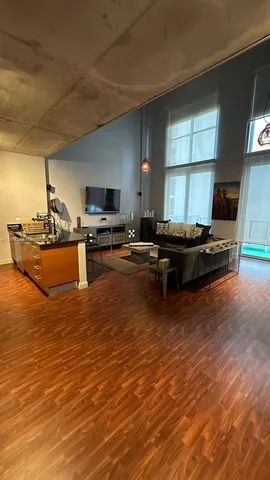 a kitchen with stainless steel appliances granite countertop a sink a stove counter space and cabinets