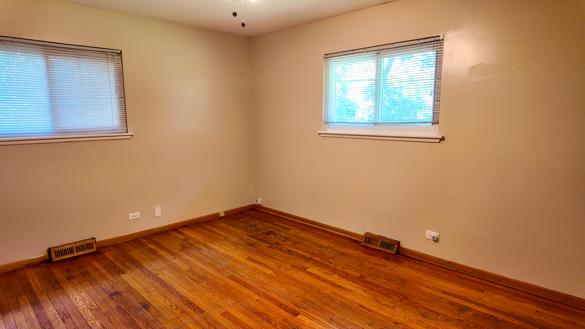 3506 Ithaca Road Olympia Fields, IL 60461 - Photo 23 of 28 an empty room with wooden floor and windows