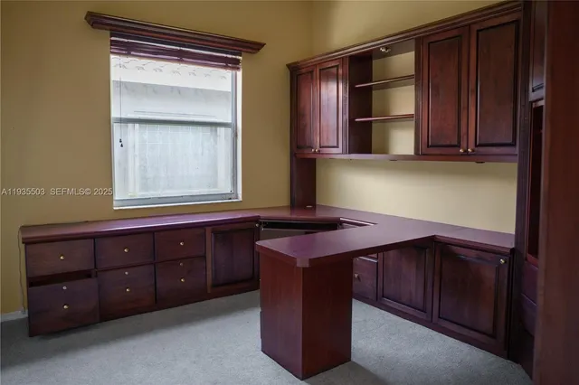 a view of a storage & utility room with two washing machine