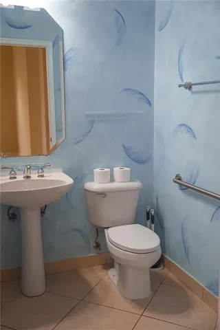 a kitchen with stainless steel appliances a sink and a refrigerator