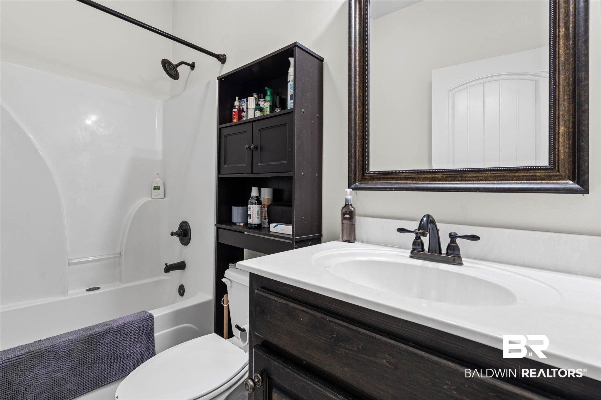800 Galoway Avenue Mobile, AL 36609 - Photo 16 of 22 Bathroom vanity with an integrated sink and white countertop