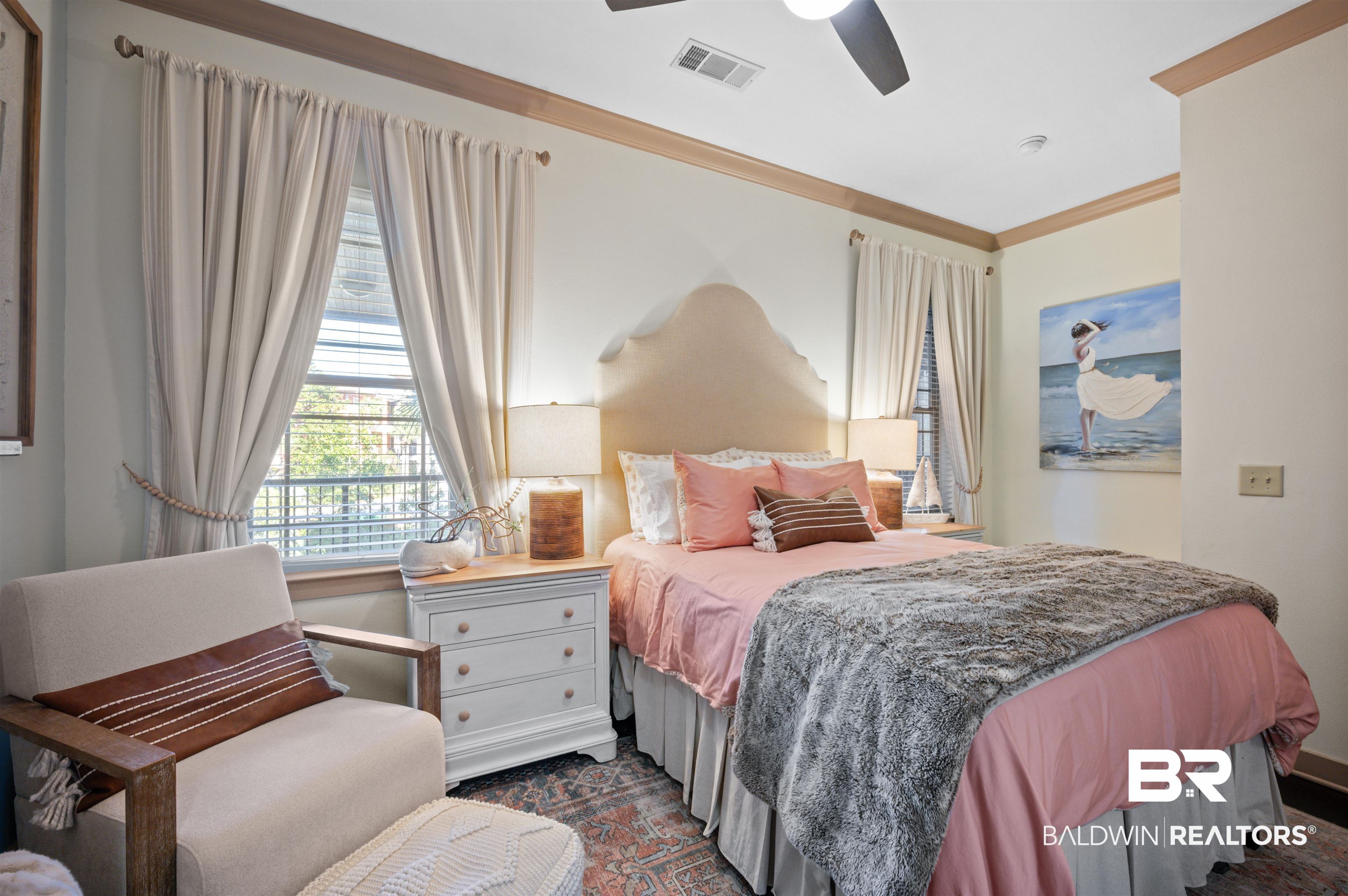 1430 Regency Road, Unit B202 Gulf Shores, AL 36542 - Photo 11 of 33 Bedroom with ceiling fan, ornamental molding, and visible vents