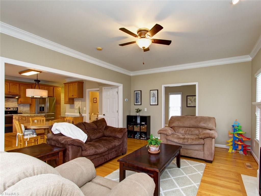 8118 Chestershire Road Oak Ridge, NC 27310 - Photo 11 of 19 Such a great flow in this home for entertaining. Don't you just love all the hardwood floors.