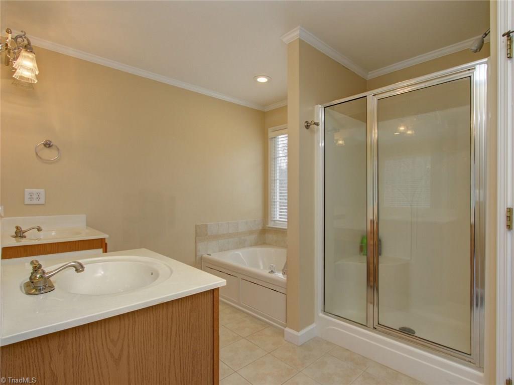 8118 Chestershire Road Oak Ridge, NC 27310 - Photo 13 of 19 Master has garden tub and separate shower. Double sinks and a private toilet room complete the bath...and of course a linen closet!