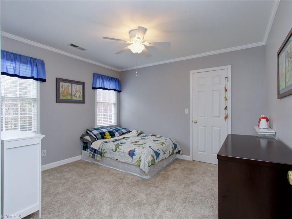 8118 Chestershire Road Oak Ridge, NC 27310 - Photo 14 of 19 Bedroom 2 is spacious and has a walk-in closet! Wow. Also the carpet is all new on the second floor.
