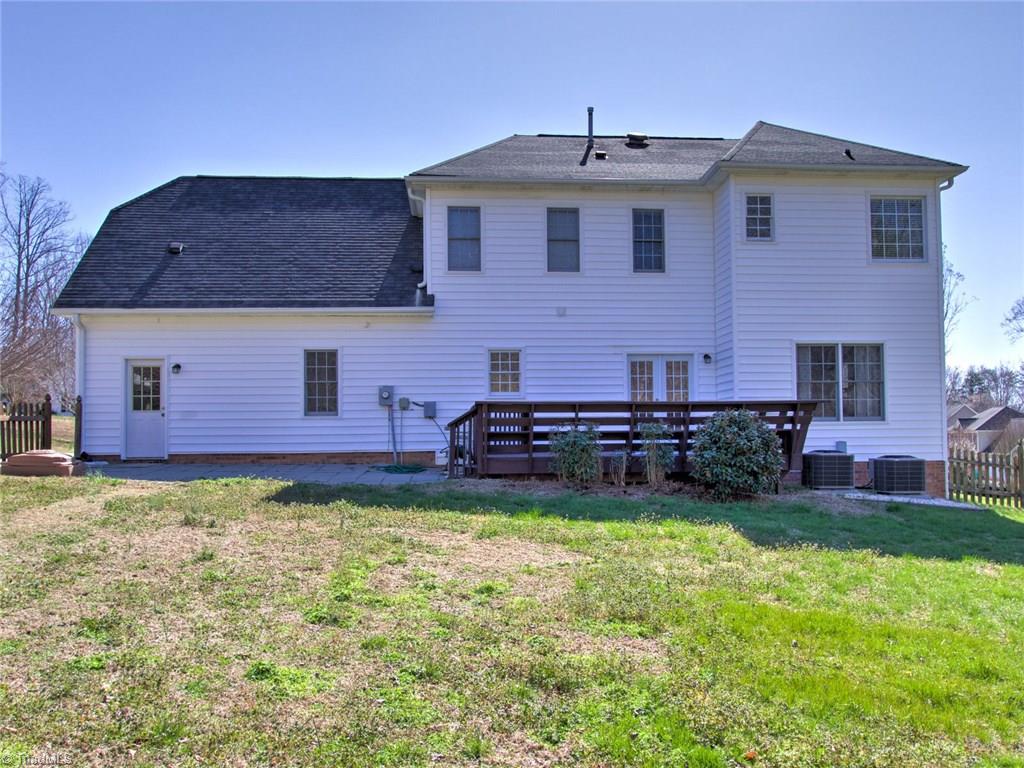 8118 Chestershire Road Oak Ridge, NC 27310 - Photo 17 of 19 Fenced with a great deck. Imagine all the fun in the coming warm weather.