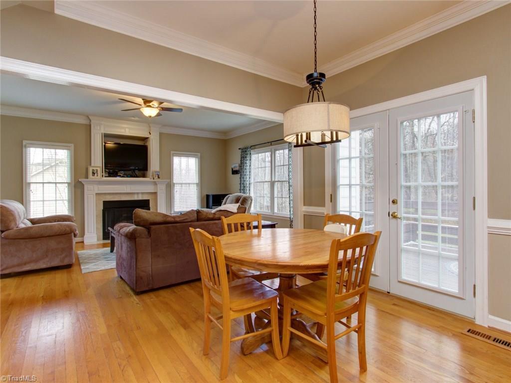 8118 Chestershire Road Oak Ridge, NC 27310 - Photo 9 of 19 Kitchen opens to Den. You never have to miss a game while cooking those wings!