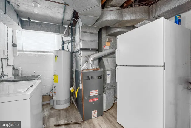 a view of storage and utility room with washer and dryer