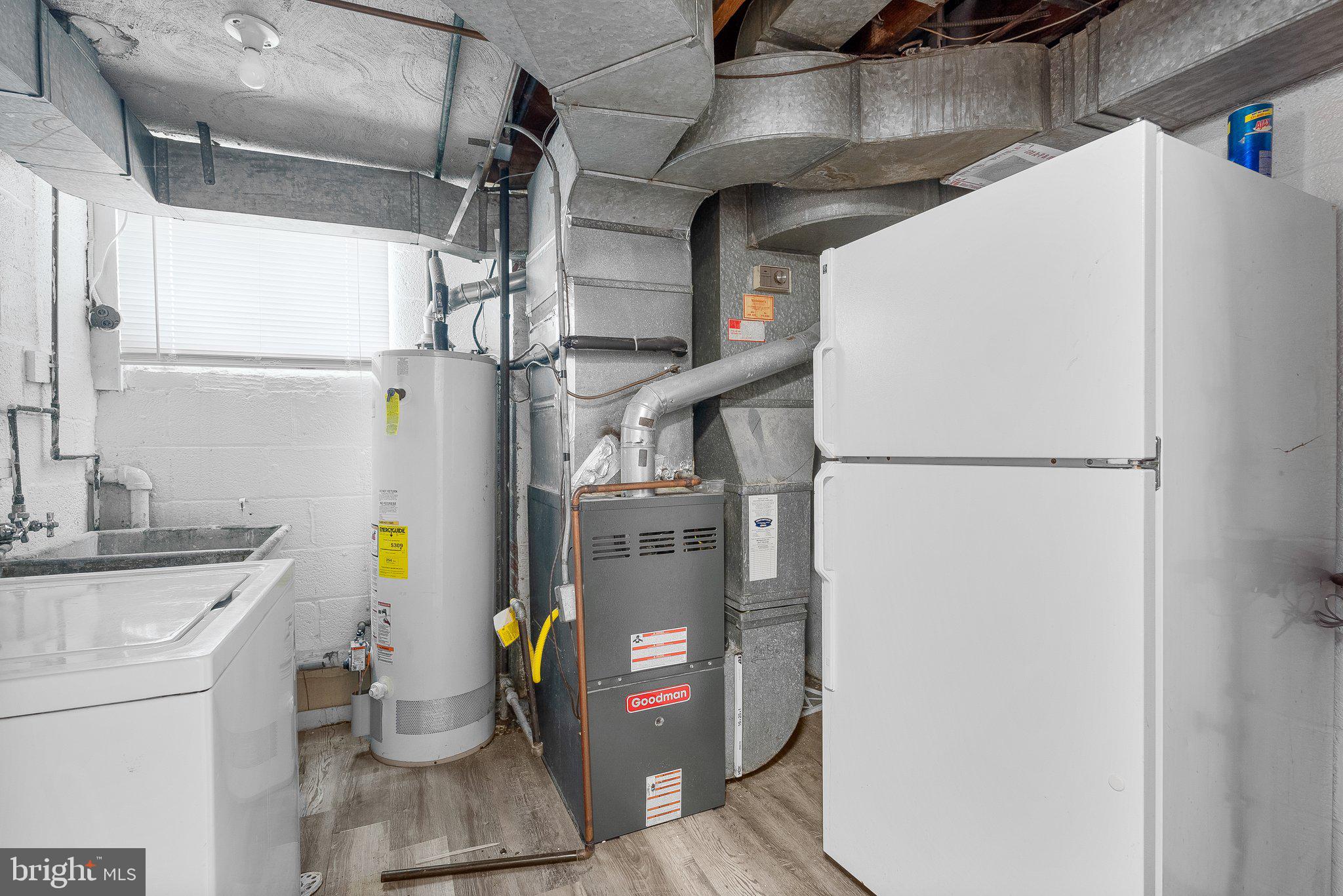 10112 Sutherland Road Silver Spring, MD 20901 - Photo 21 of 29 a view of storage and utility room with washer and dryer