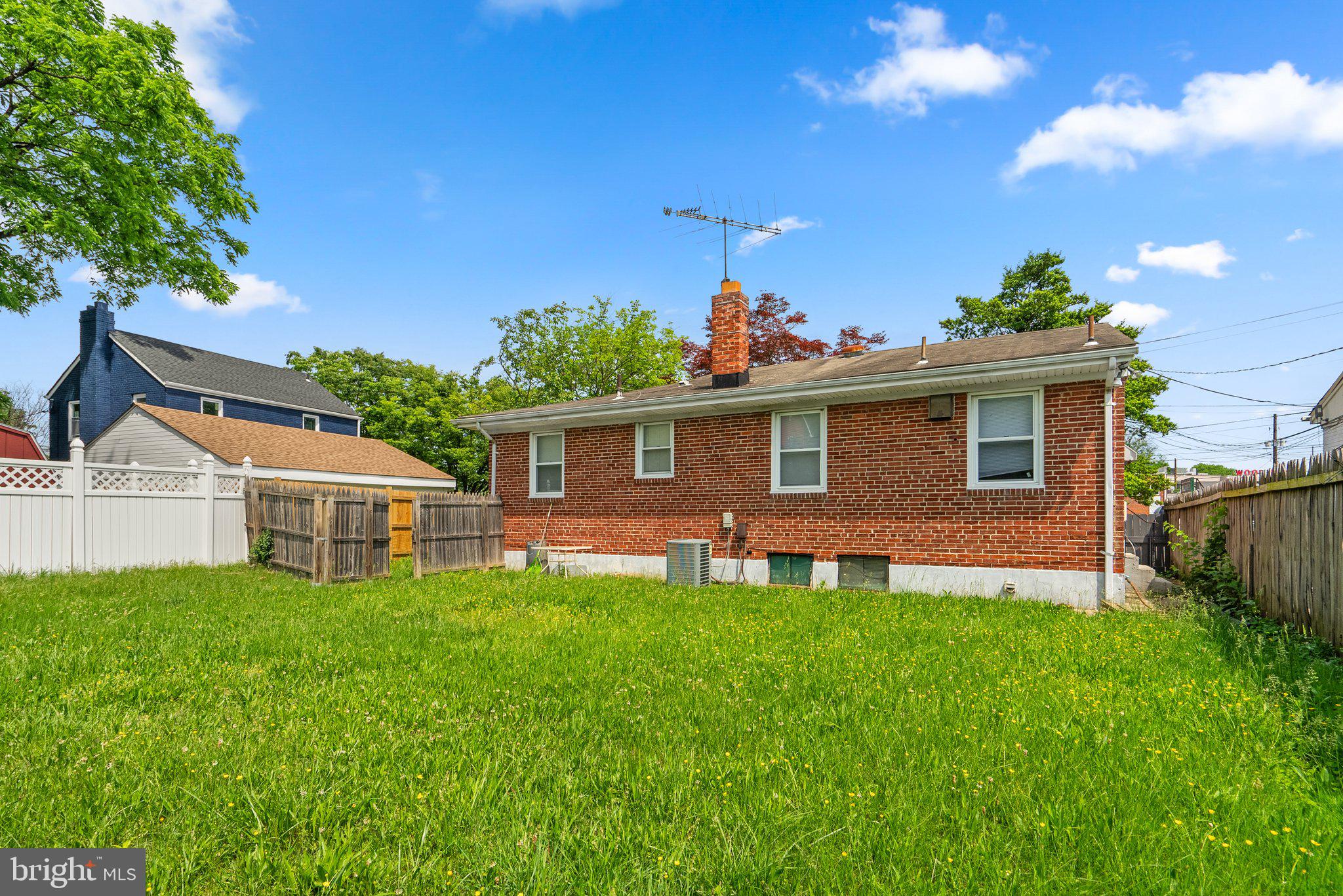 10112 Sutherland Road Silver Spring, MD 20901 - Photo 28 of 29 a front view of a house with a garden and yard