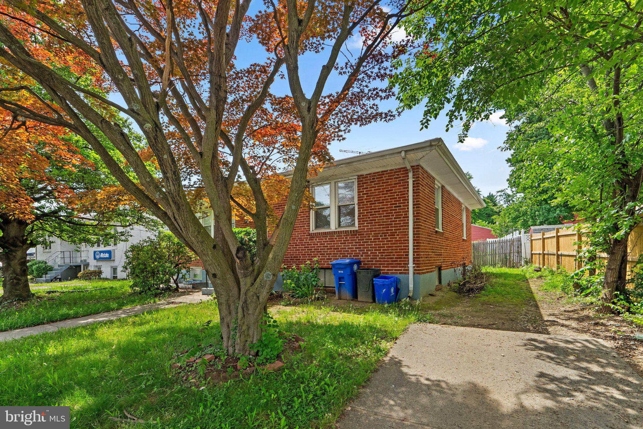 10112 Sutherland Road Silver Spring, MD 20901 - Photo 3 of 29 a front view of a house with garden