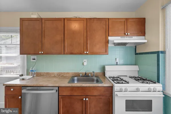 a utility room with a stove top oven