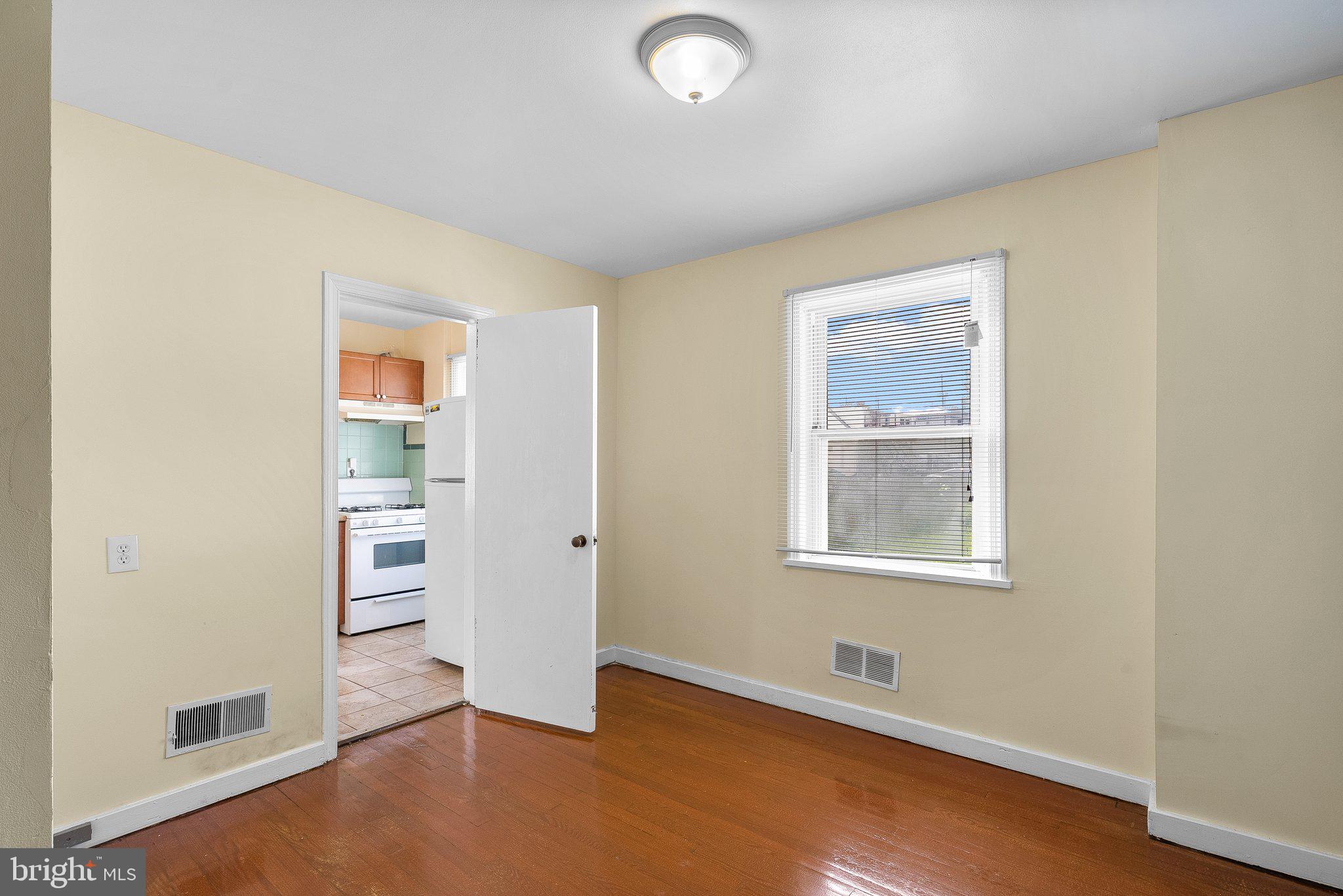 10112 Sutherland Road Silver Spring, MD 20901 - Photo 10 of 29 an empty room with windows