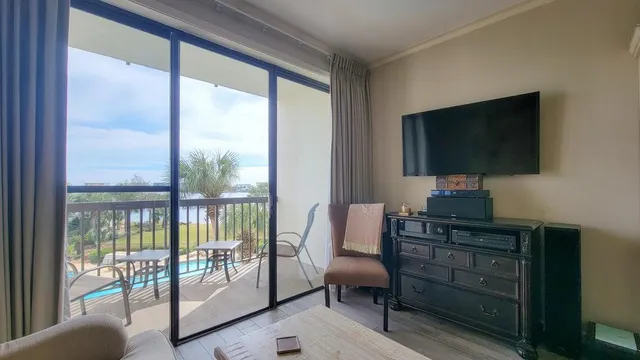 a living room with furniture and a flat screen tv