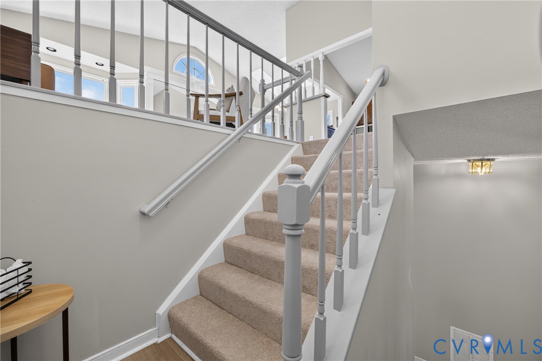 1559 Tree Ridge Road Henrico, VA 23231 - Photo 6 of 40 Carpeted staircase with painted balusters and hand