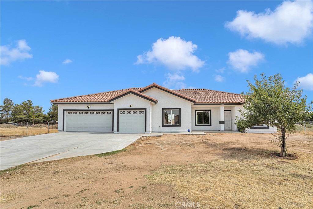 12999 Mohawk Road Apple Valley, CA 92308 - Photo 1 of 1 a view of a house with a yard
