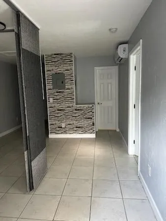 a kitchen with a refrigerator sink and cabinets