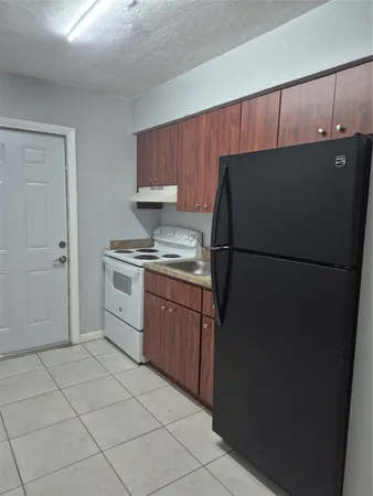 a white toilet sitting next to a shower curtain