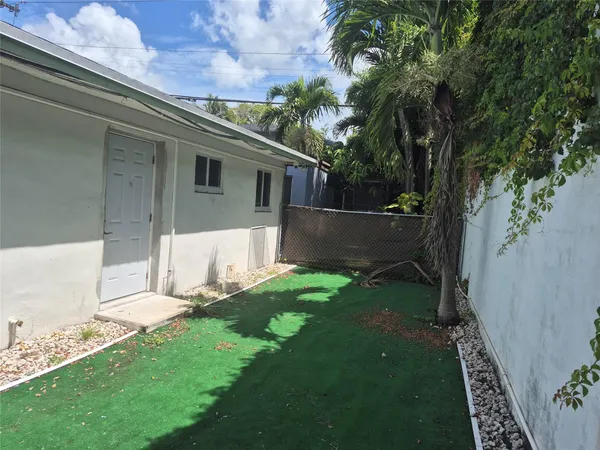a view of a backyard with a garden