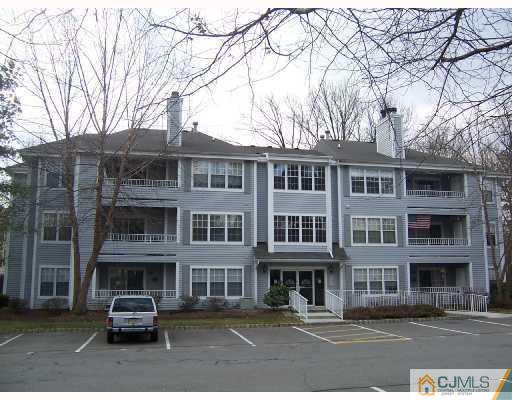 303 Raintree Court Helmetta, NJ 08828 - Photo 1 of 3 a car parked in front of a building