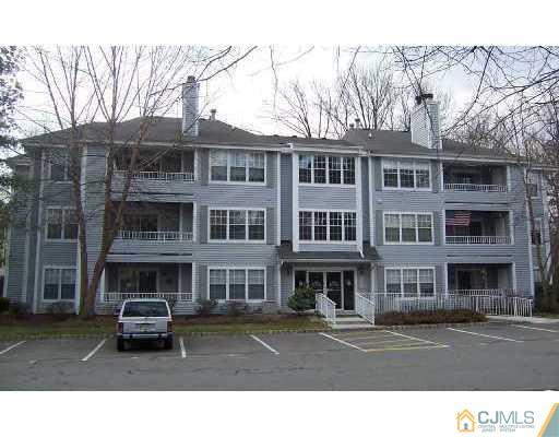 303 Raintree Court Helmetta, NJ 08828 - Photo 2 of 3 a black and white photo of a building