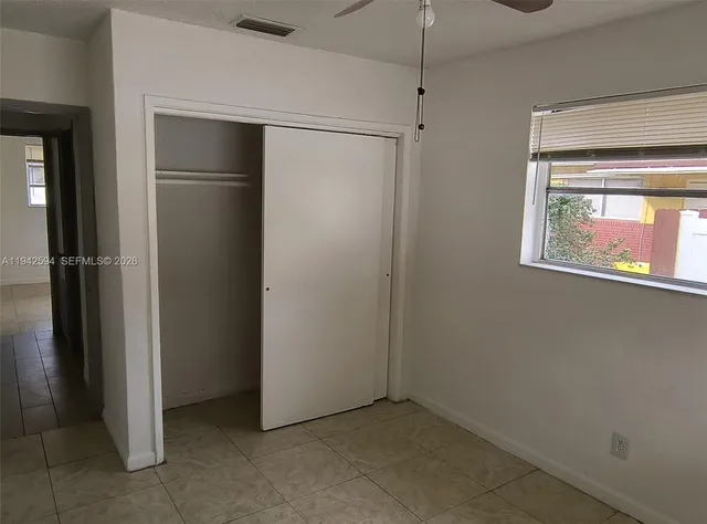 a view of an empty room with a window