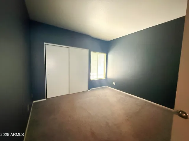 a view of hallway with wooden floor