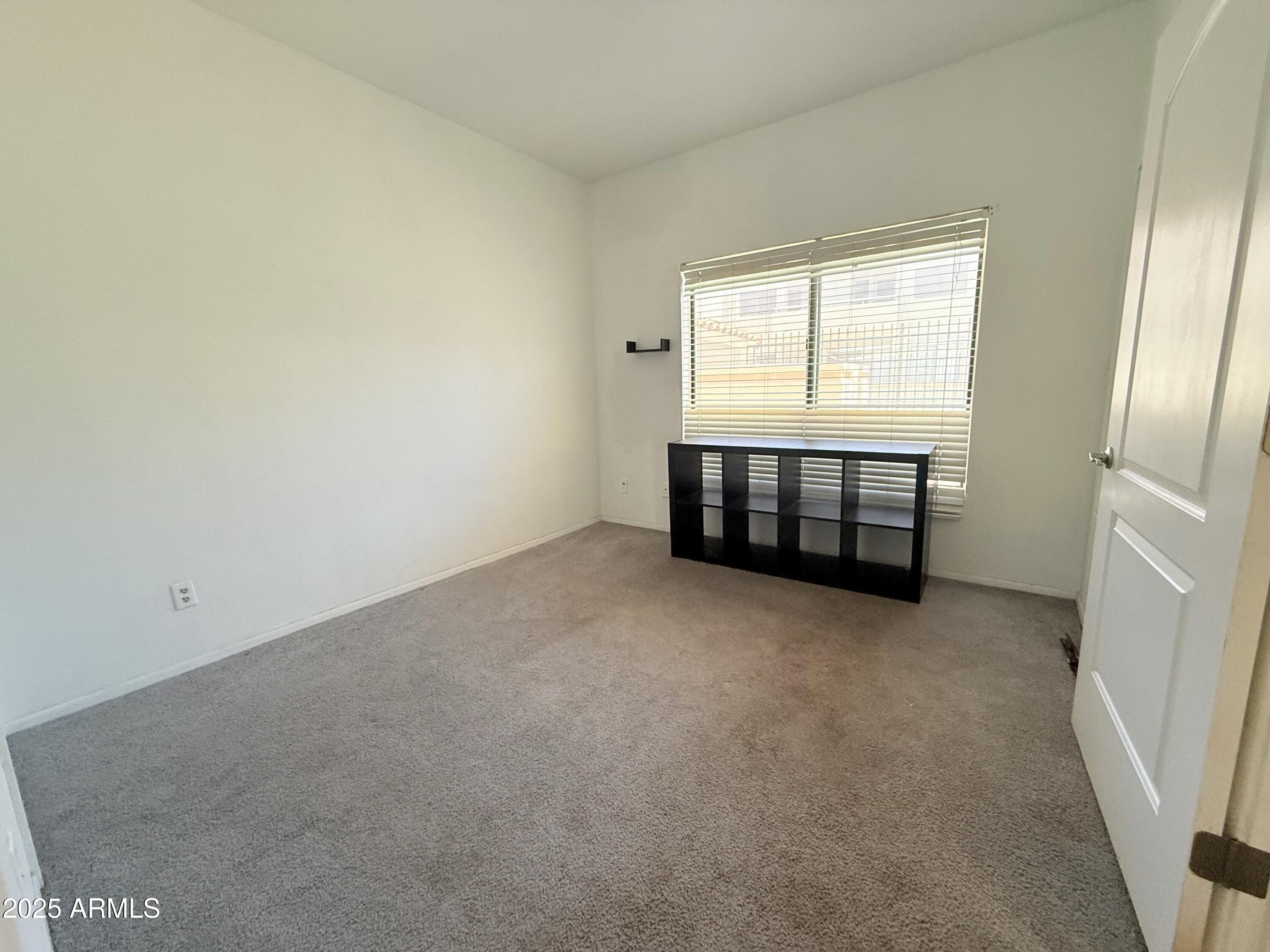 11666 North 28th Drive, Unit 155 Phoenix, AZ 85029 - Photo 18 of 28 an empty room with windows