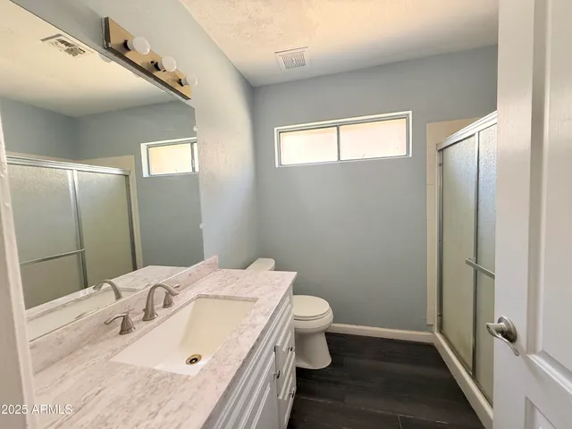 a bathroom with a sink and vanity