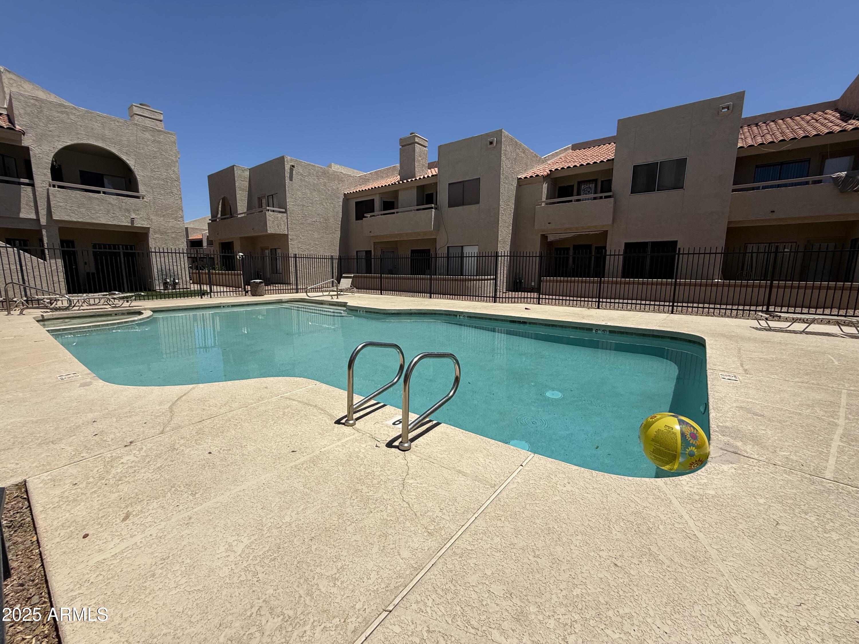 11666 North 28th Drive, Unit 155 Phoenix, AZ 85029 - Photo 24 of 28 a swimming pool with outdoor seating and yard