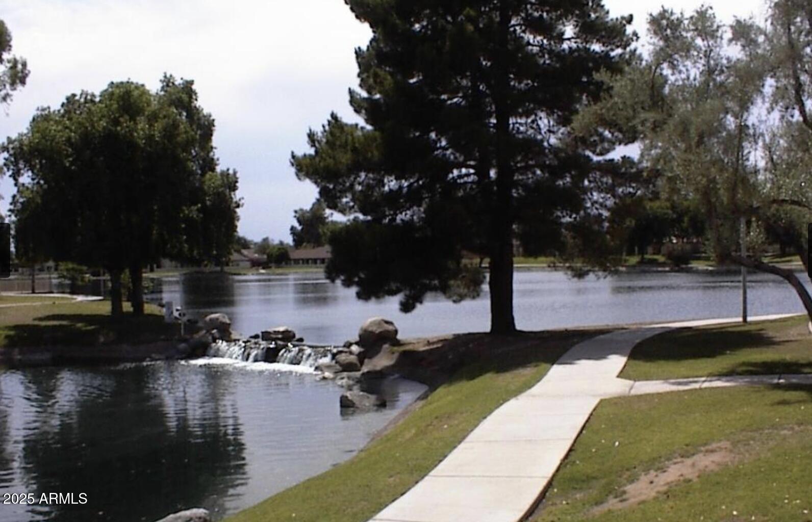 11666 North 28th Drive, Unit 155 Phoenix, AZ 85029 - Photo 26 of 28 a view of a lake with houses