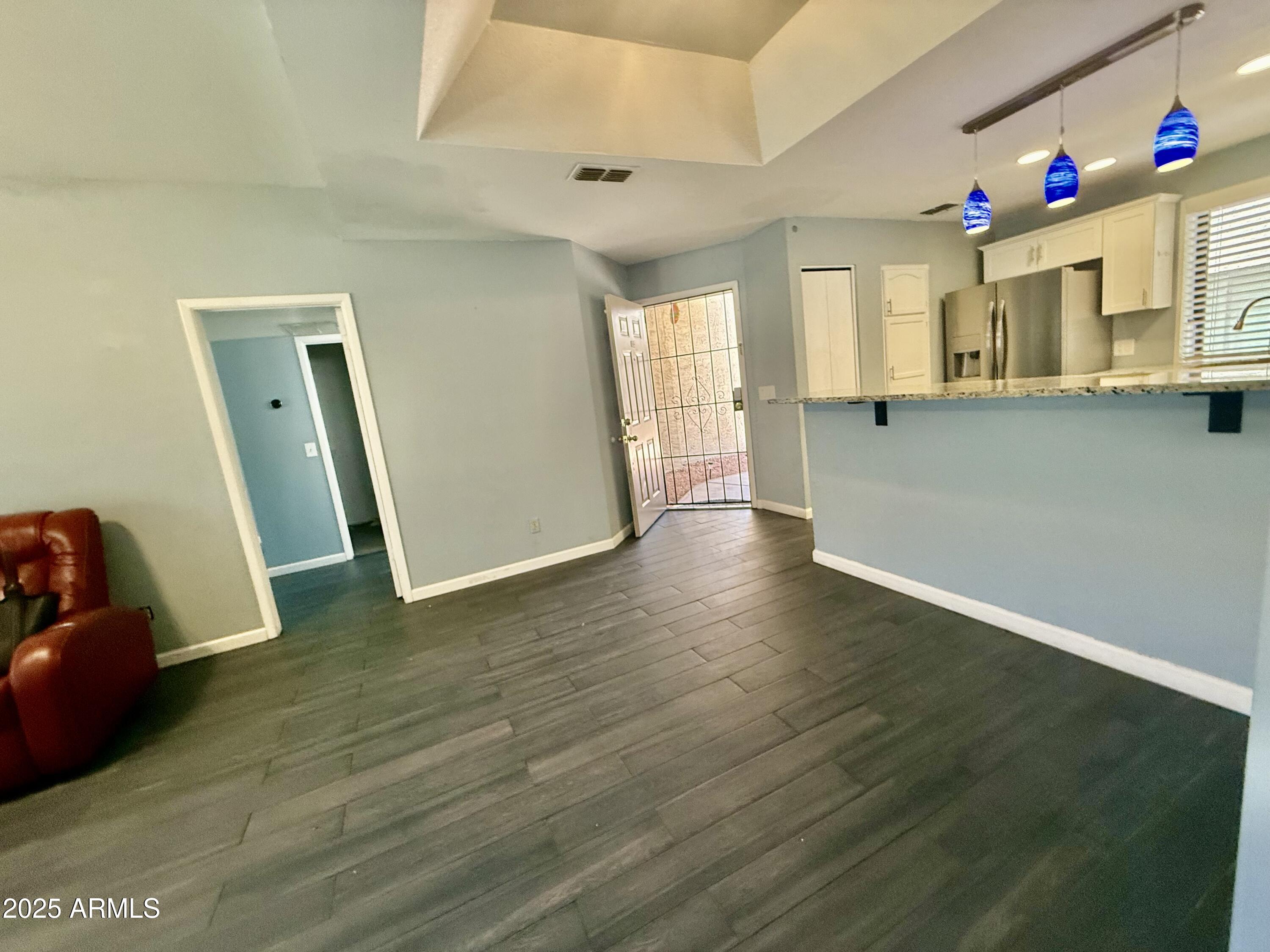 11666 North 28th Drive, Unit 155 Phoenix, AZ 85029 - Photo 8 of 28 a view of empty room with wooden floor