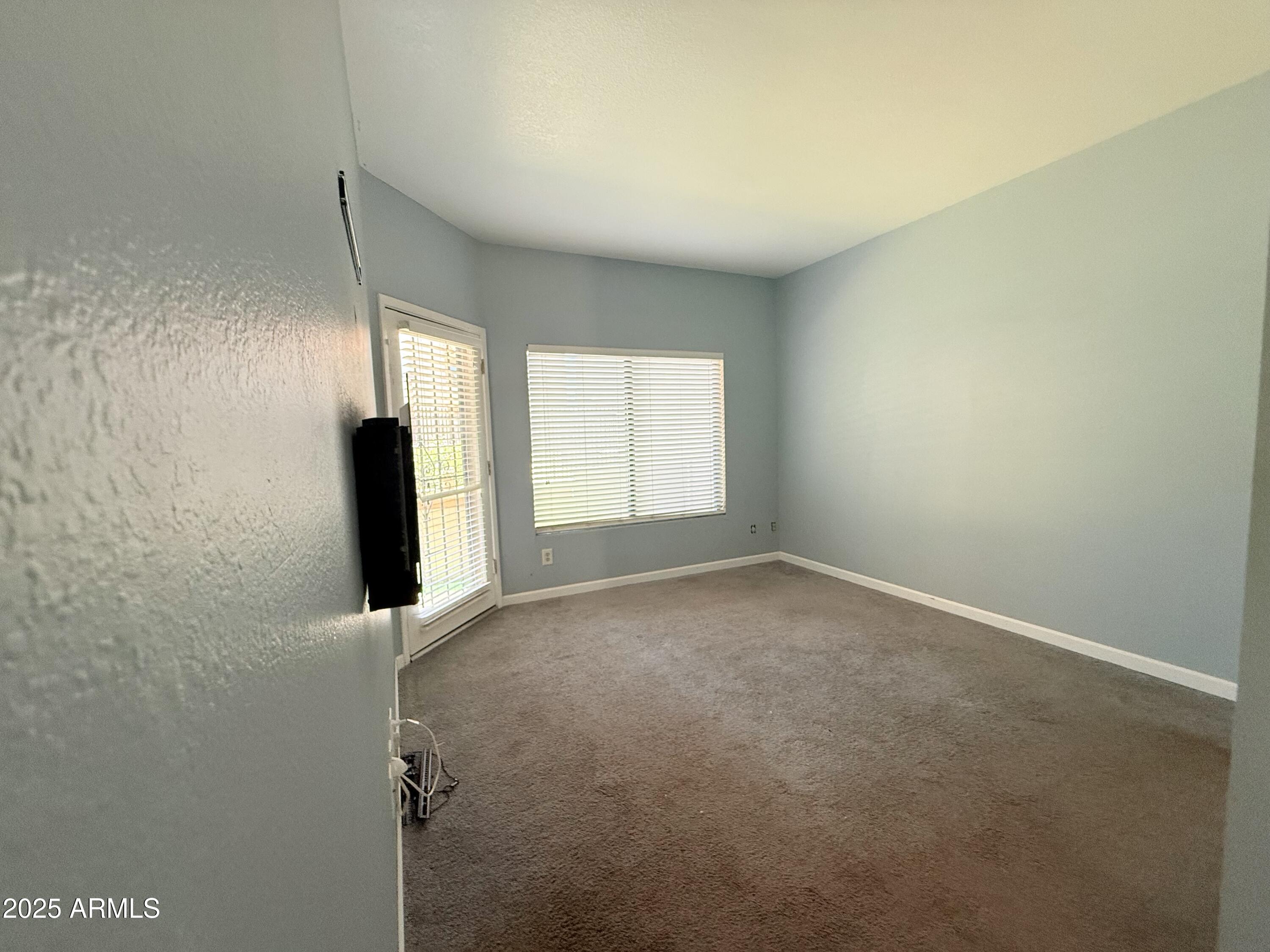 11666 North 28th Drive, Unit 155 Phoenix, AZ 85029 - Photo 10 of 28 an empty room with windows