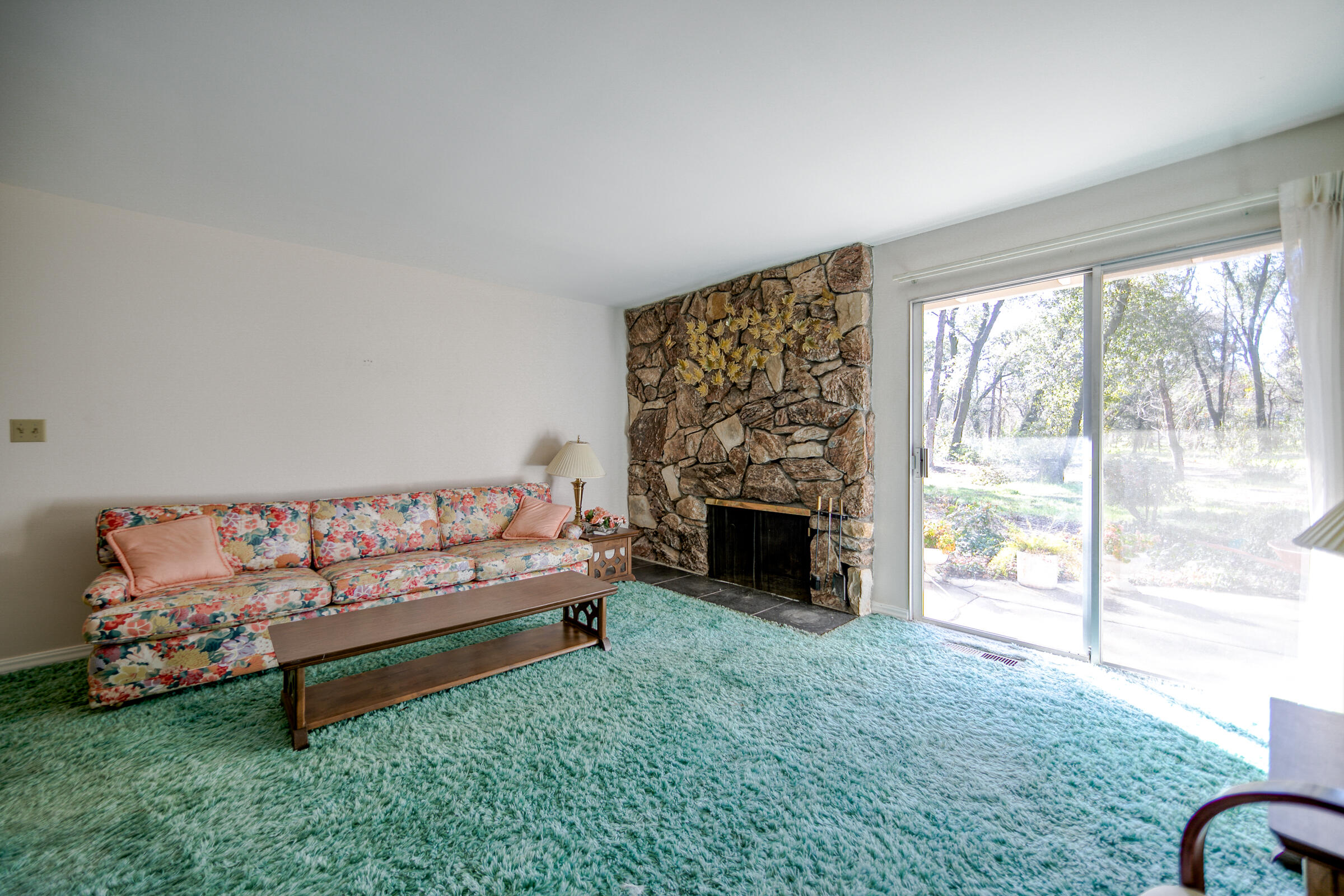 8442 Ranchette Drive Redding, CA 96001 - Photo 13 of 26 a bedroom with a bed and a fireplace