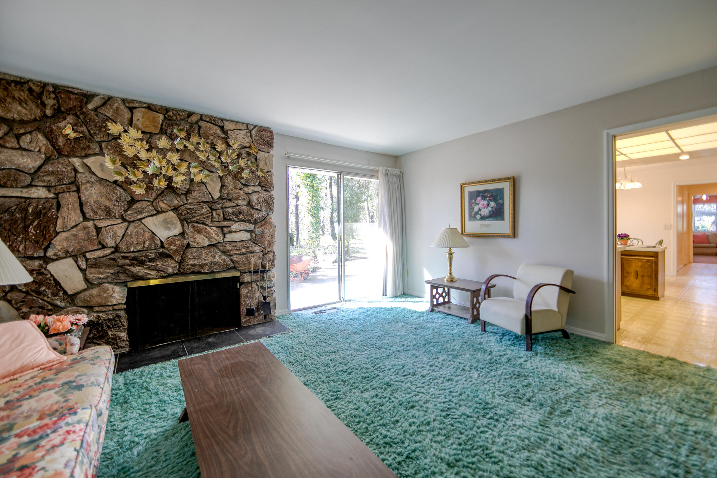 8442 Ranchette Drive Redding, CA 96001 - Photo 15 of 26 a living room with furniture and a fireplace