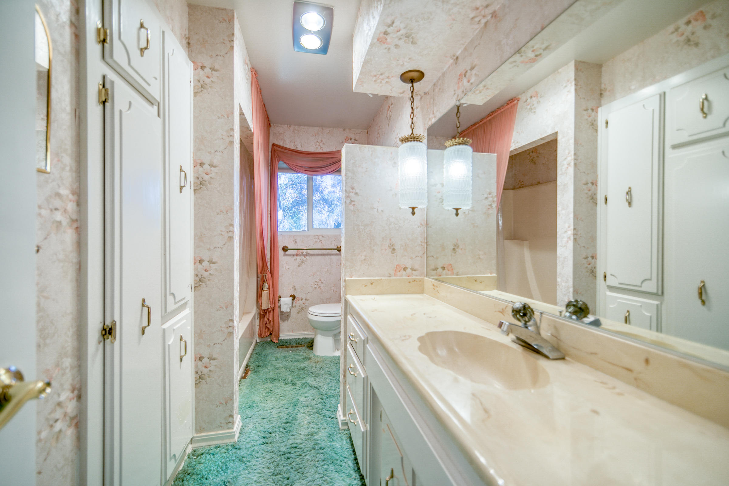 8442 Ranchette Drive Redding, CA 96001 - Photo 16 of 26 a bathroom with a sink vanity granite shower and a mirror