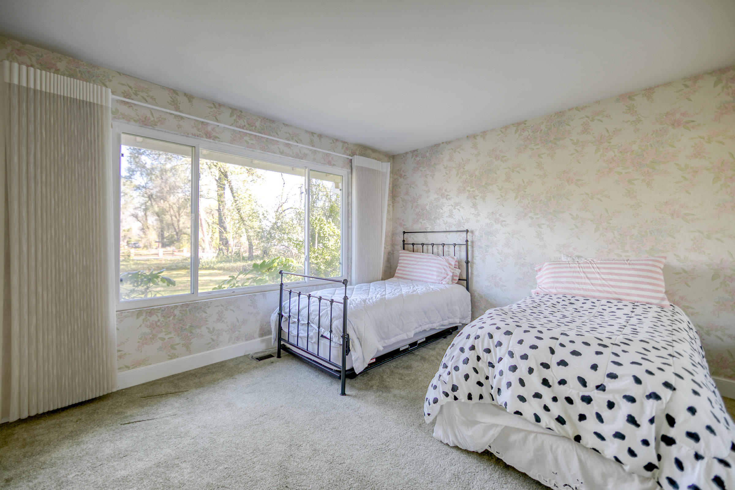 8442 Ranchette Drive Redding, CA 96001 - Photo 17 of 26 a bedroom with two beds and a window