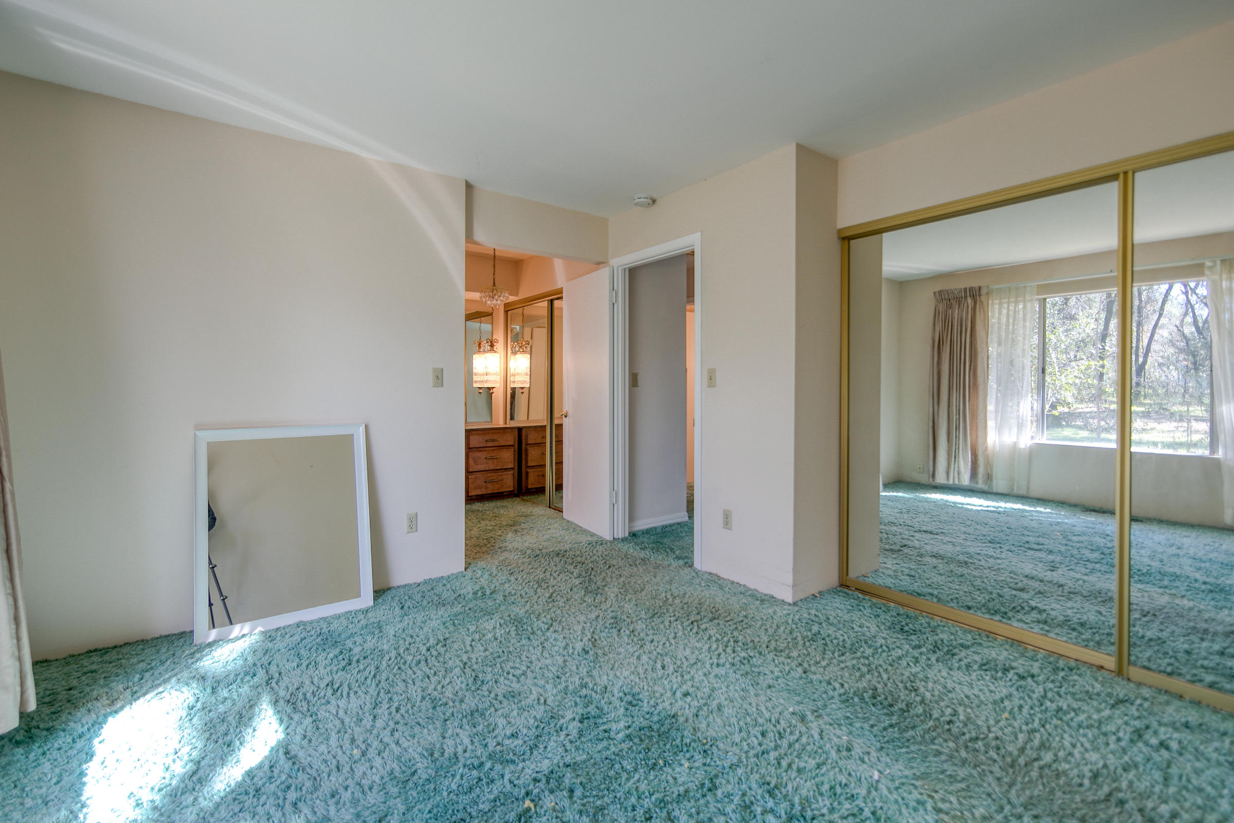 8442 Ranchette Drive Redding, CA 96001 - Photo 19 of 26 an empty room with windows and closet