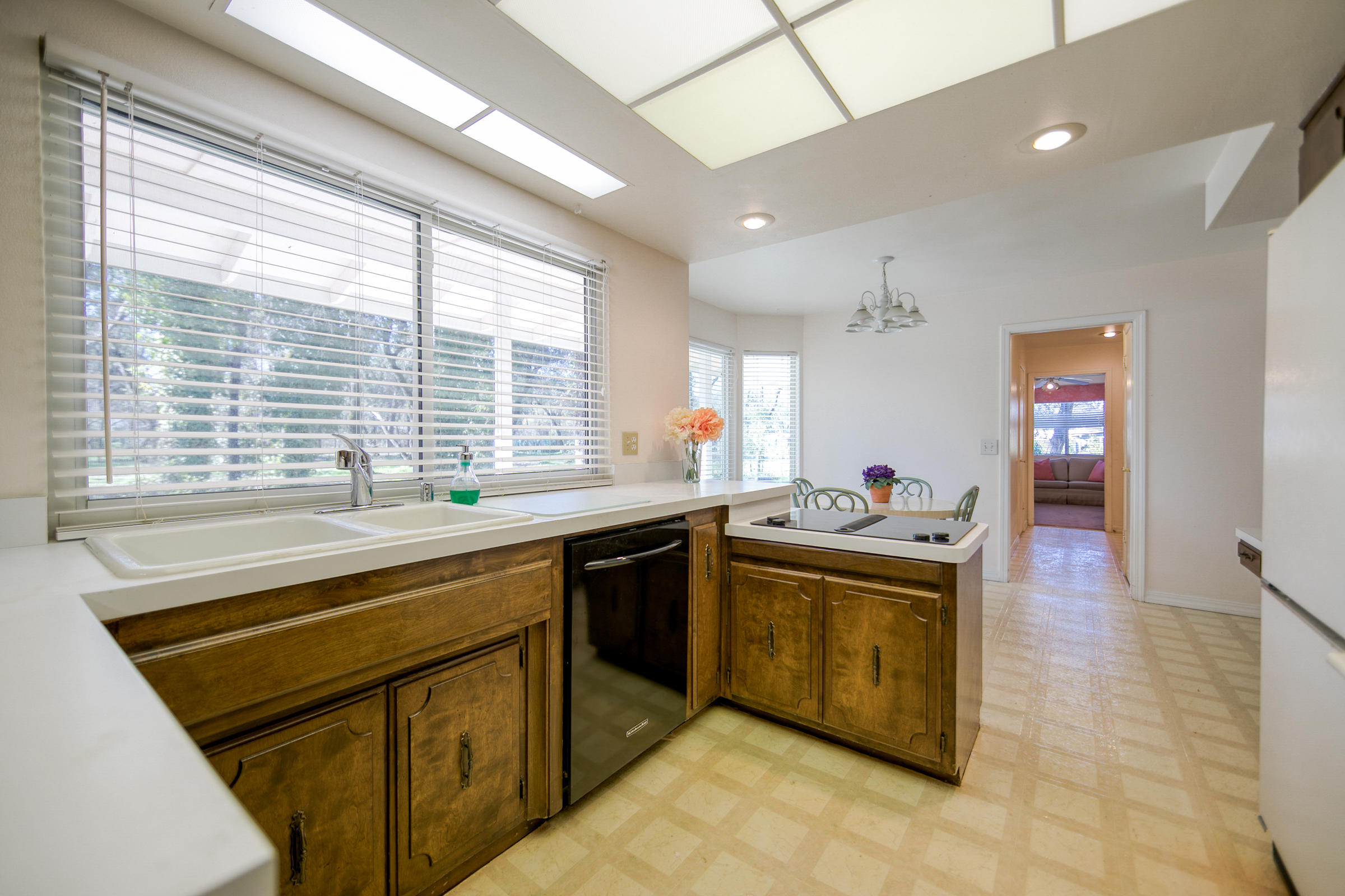 8442 Ranchette Drive Redding, CA 96001 - Photo 25 of 26 a kitchen with stainless steel appliances granite countertop a sink and a stove