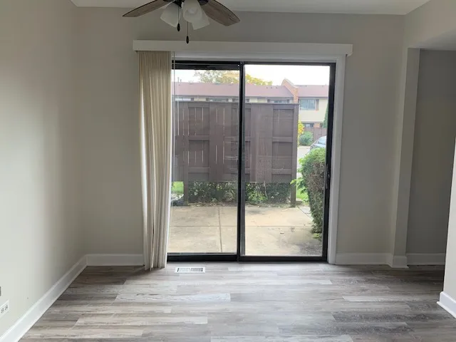 a view of an empty room and window