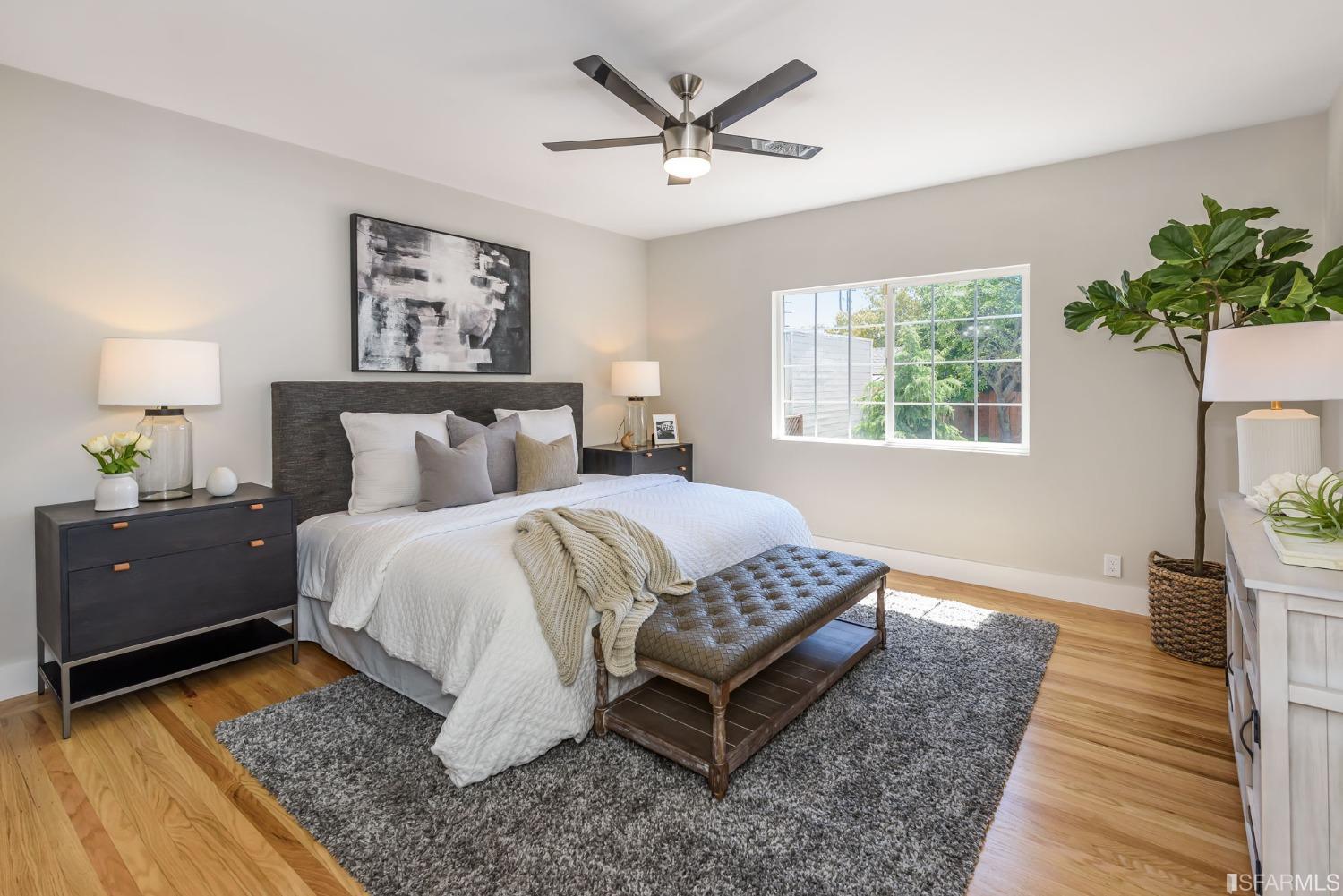 9 Bancroft Road Burlingame, CA 94010 - Photo 19 of 45 a bedroom with a bed and a potted plant