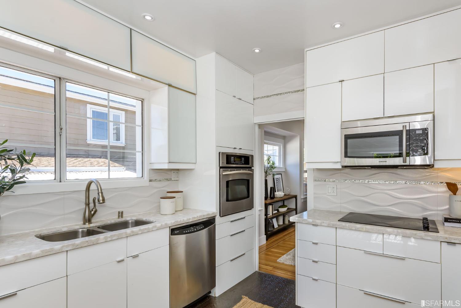 9 Bancroft Road Burlingame, CA 94010 - Photo 30 of 45 a kitchen with a sink microwave and cabinets