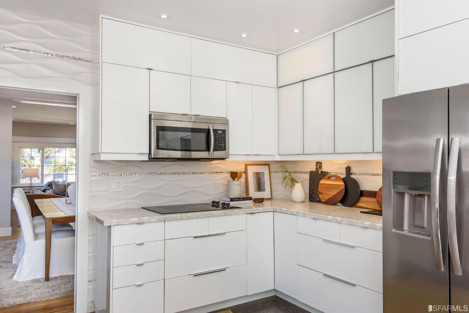 9 Bancroft Road Burlingame, CA 94010 - Photo 31 of 45 a kitchen with stainless steel appliances a refrigerator sink and microwave