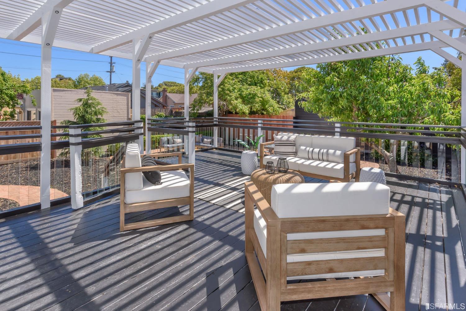 9 Bancroft Road Burlingame, CA 94010 - Photo 34 of 45 a view of a patio with a table chairs and wooden floor